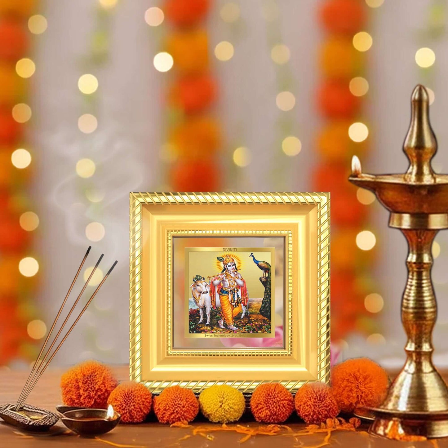 Lord Krishna with Surbhi Cow tabletop frame in a beautifully designed wall and tabletop photo frame, adorned with vibrant marigold flowers.