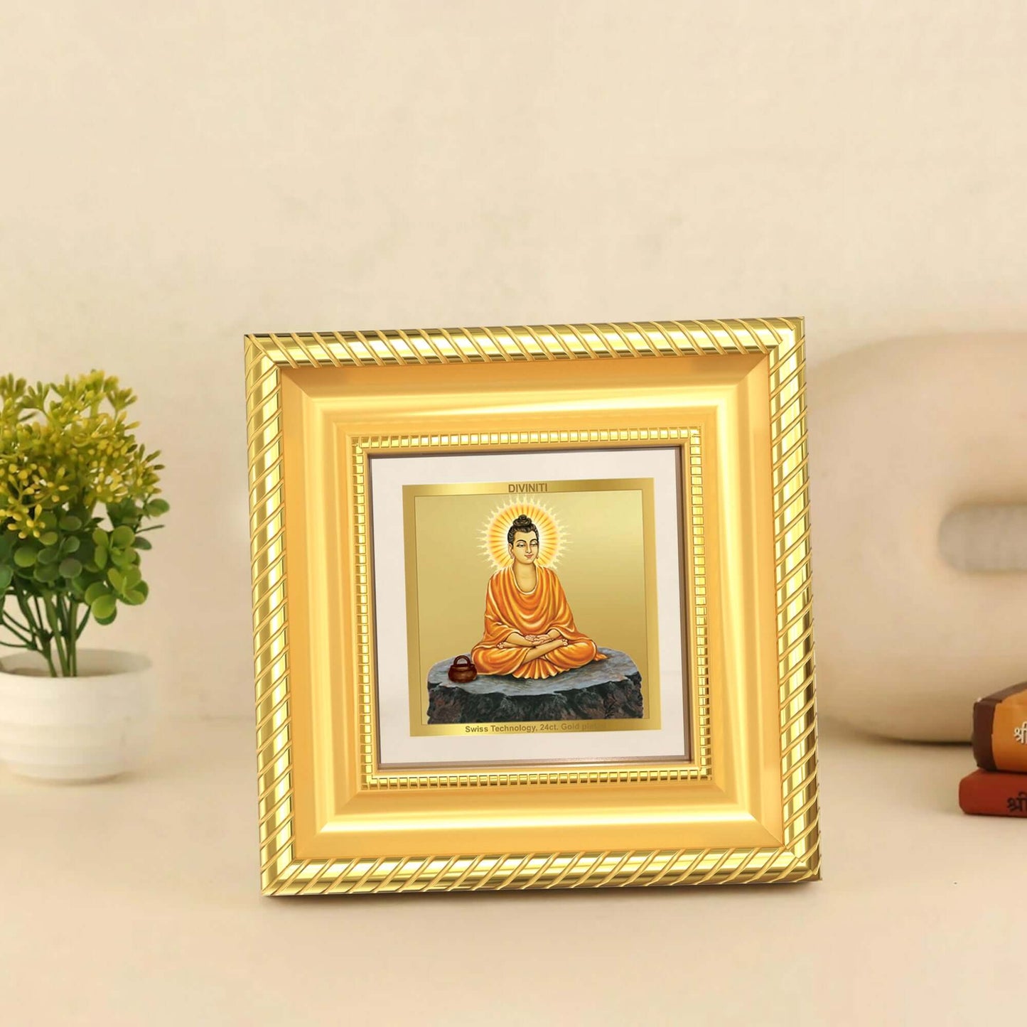 Lord Buddha Photo Frame in 24k gold plated foil displayed on wooden table