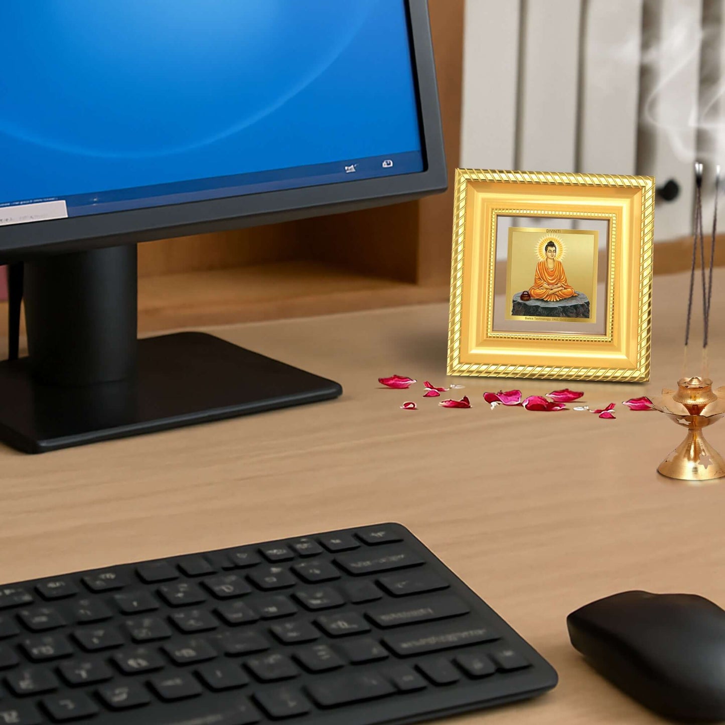 Lord Buddha Photo Frame in 24k gold plated foil displayed on office table