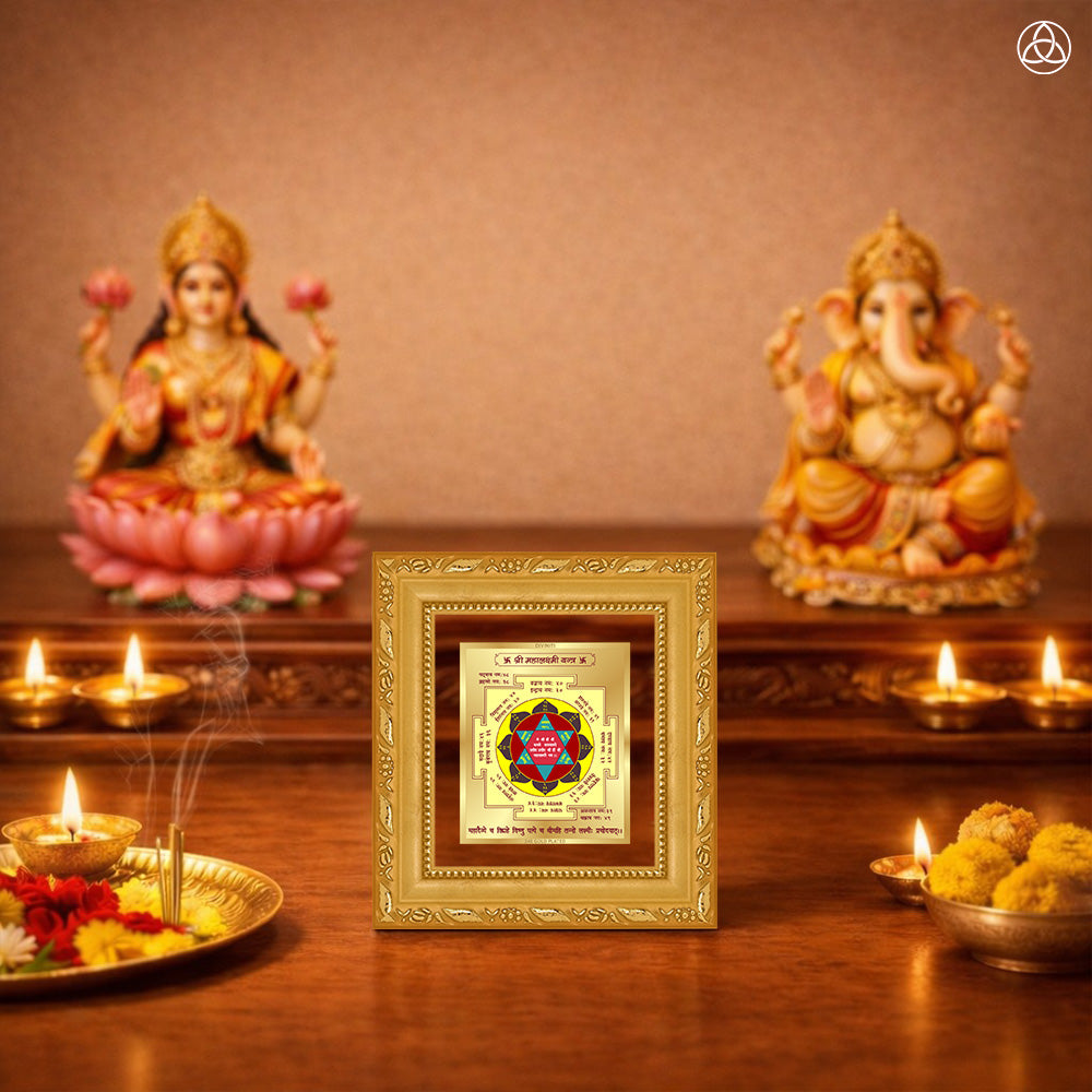 Maha Laxmi Yantra displayed on a decorated altar with candles and idols of Hindu deities for spiritual harmony.