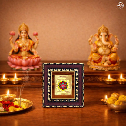 Maha Laxmi Yantra displayed on a decorated altar with candles and idols of Hindu deities for spiritual harmony.
