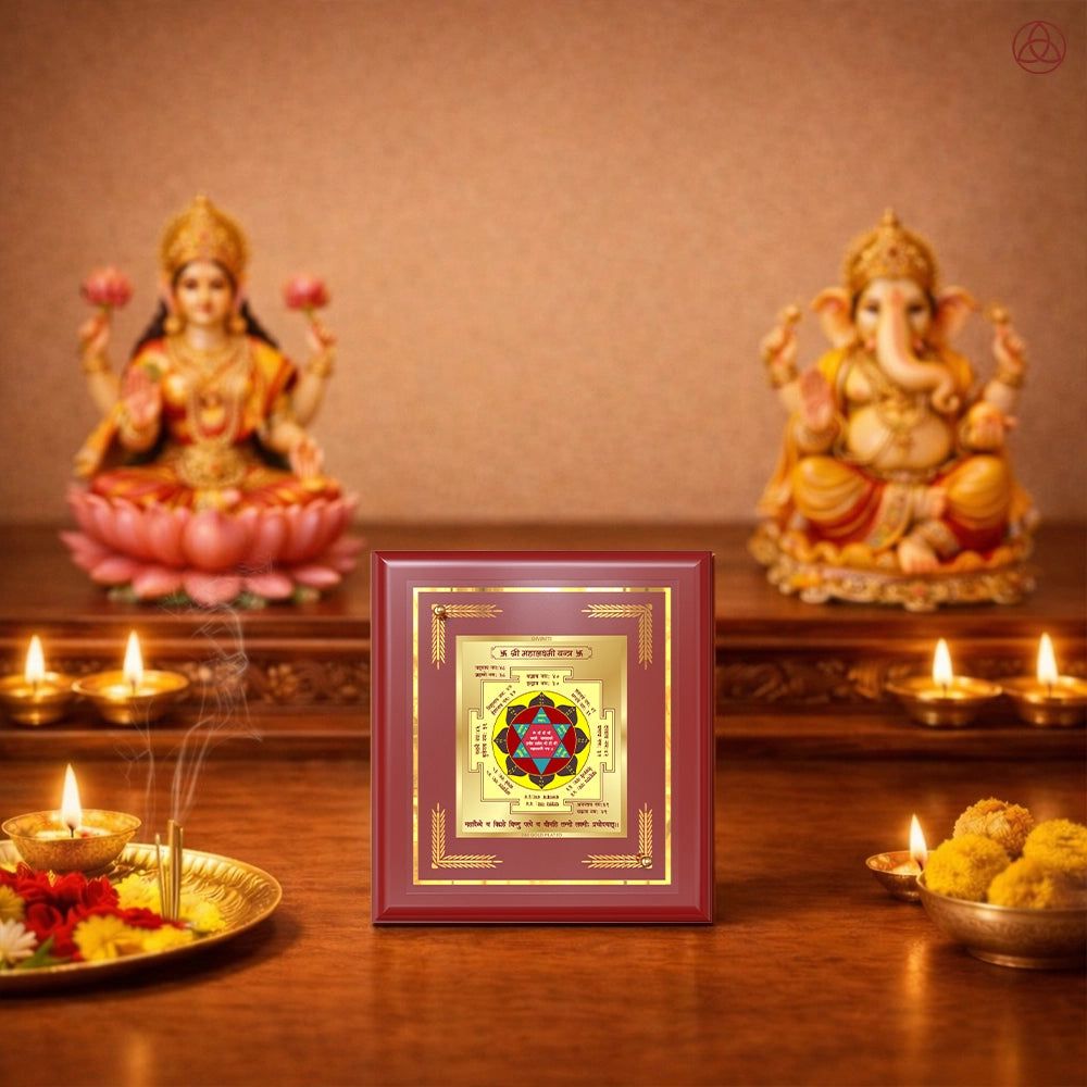 Maha Laxmi Yantra displayed in a decorative frame on a wooden table, symbolizing planetary energies.