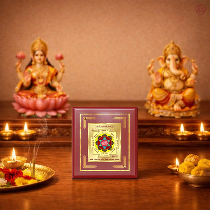 Maha Laxmi Yantra displayed in a decorative frame on a wooden table, symbolizing planetary energies.