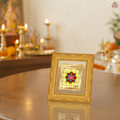 Maha Laxmi Yantra displayed in a decorative frame on a wooden table, symbolizing planetary energies.