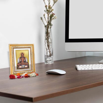Lord Mahavira Photo Frame in 24K Gold Plated Foil displayed on wooden table