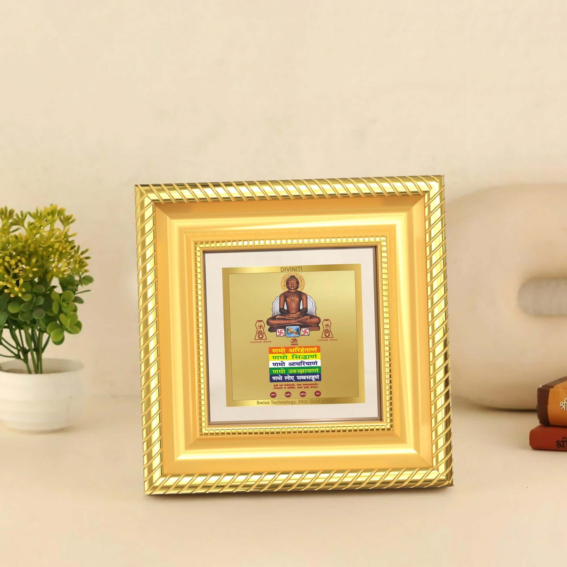 Lord Mahavira with Namokar Mantra displayed on wooden table