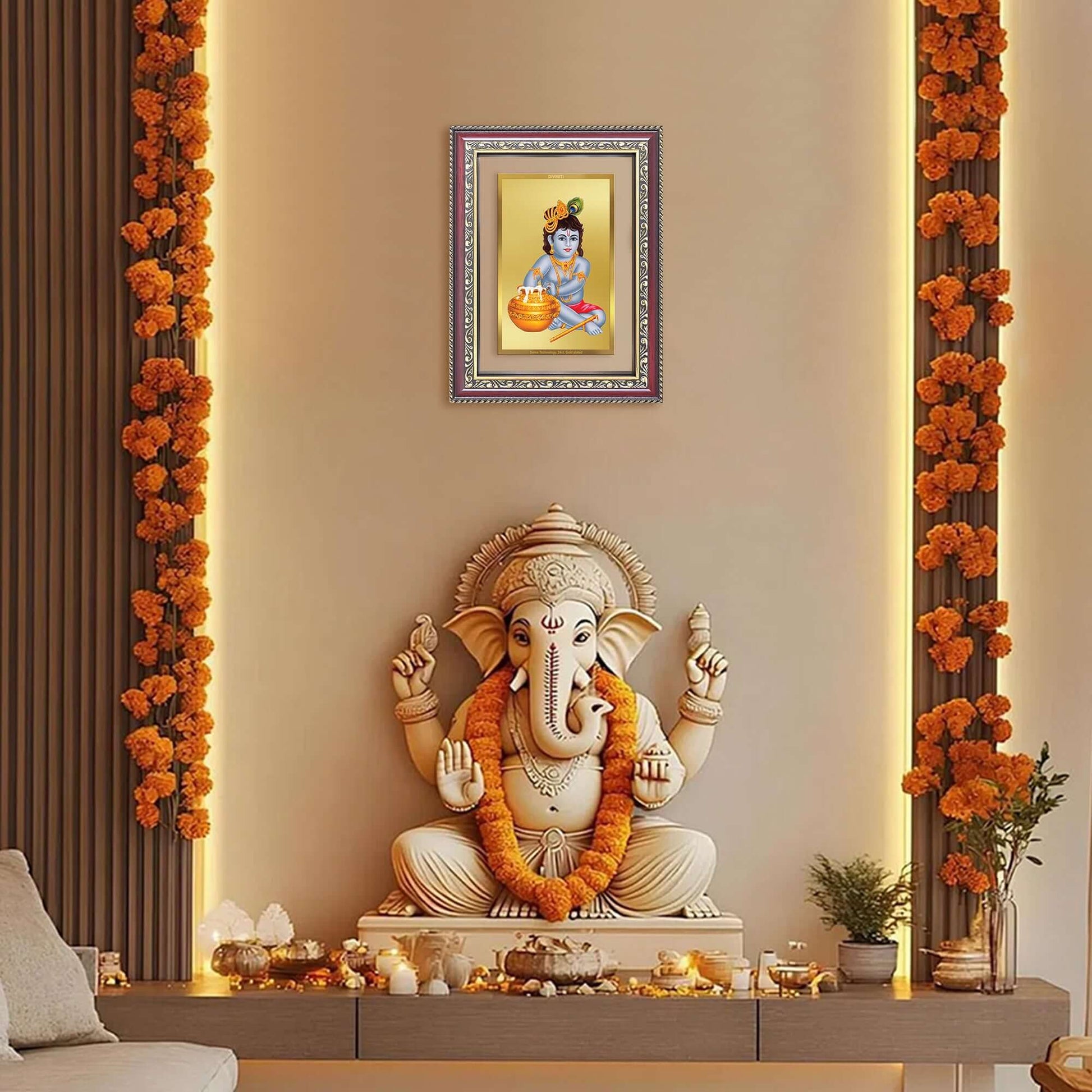 Bal Makhan Gopal | Baby Krishna | Devakinandana Wall and Tabletop Photo Frame in 24K Gold Plated Foil displayed above a statue of Ganesha.