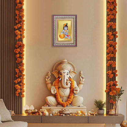 Bal Makhan Gopal | Baby Krishna | Devakinandana Wall and Tabletop Photo Frame in 24K Gold Plated Foil displayed above a statue of Ganesha.