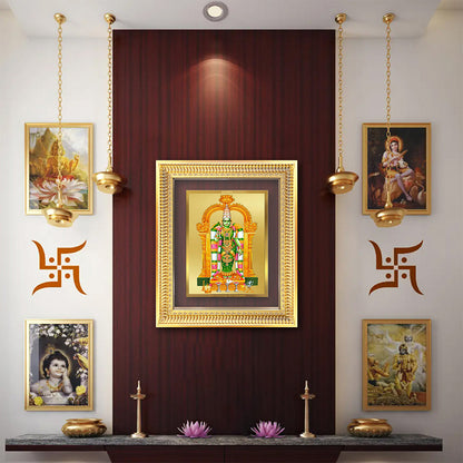 Goddess Meenakshi framed art displayed on a wooden wall with decorative lights and traditional Indian motifs.