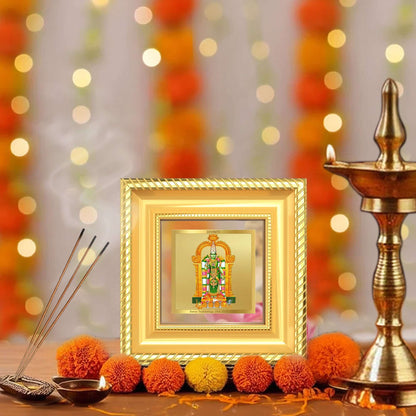 Goddess Meenakshi Tabletop Frame in 24k Gold Plated Foil in a beautifully designed wall and tabletop photo frame, adorned with vibrant marigold flowers.