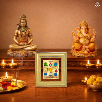 Navagraha Yantra displayed on a decorated altar with candles and idols of Hindu deities for spiritual harmony.