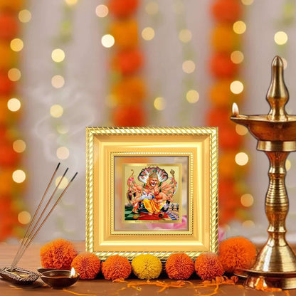 Lord Narasimha Tabletop Frame in 24K Gold Plated Foil in a beautifully designed wall and tabletop photo frame, adorned with vibrant marigold flowers.
