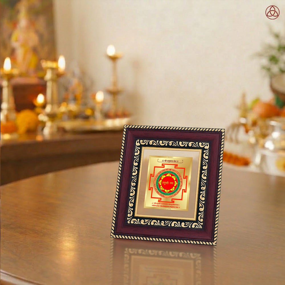 Panchmukhi Hanuman Yantra framed artwork in a spiritual setting with Lord Shiva and Ganesh statues.