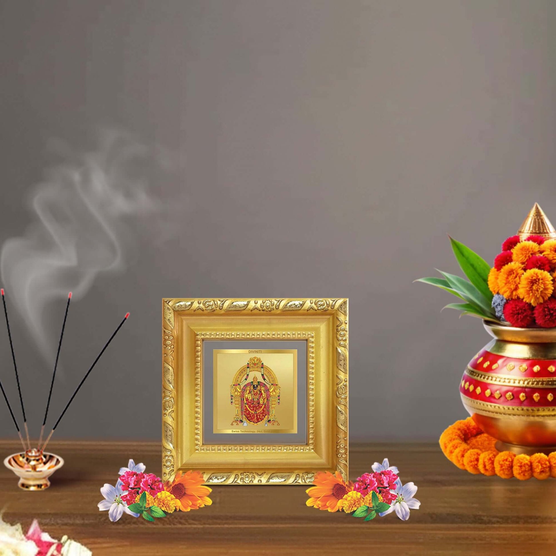 Padmavati framed in 24K gold, displayed in a beautifully decorated wooden wall shrine.