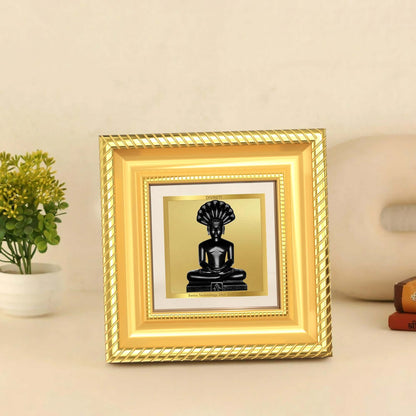 Lord Parshvanatha Tabletop Frame in 24K Gold Plated Foil displayed on wooden table