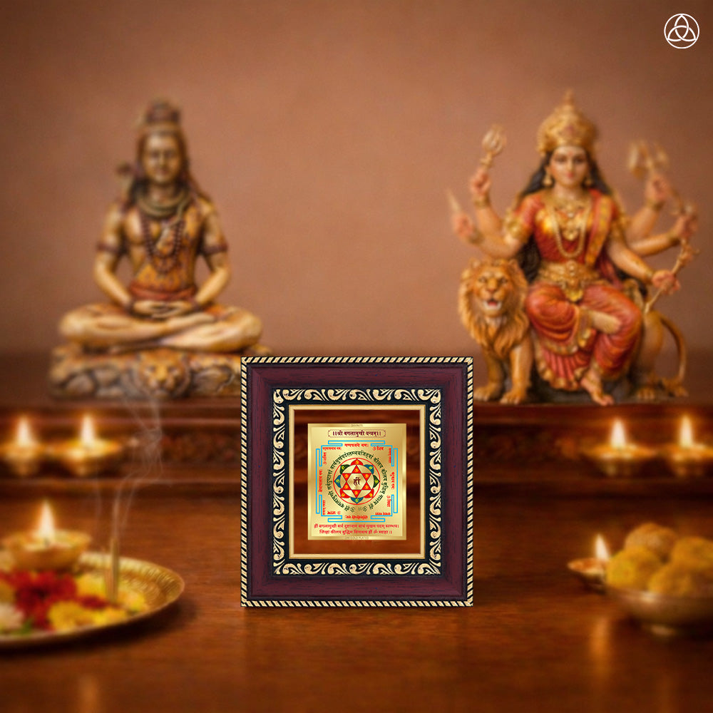 Shree Baglamukhi Yantra framed artwork on a decorative table with deities and incense.
