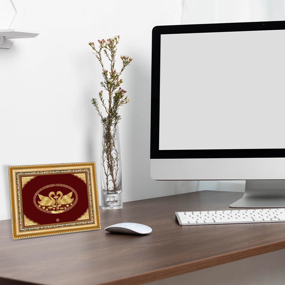 Swan Hamsa Gold Wall Hanging Frame in 24K Gold Foil displayed on table