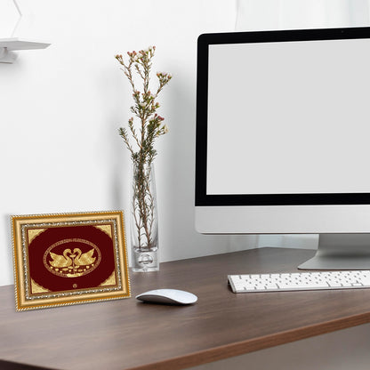 Swan Hamsa Gold Wall Hanging Frame in 24K Gold Foil displayed on table