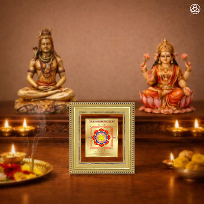 Swarn Akarshan Yantra displayed on a decorated altar with candles and idols of Hindu deities for spiritual harmony.