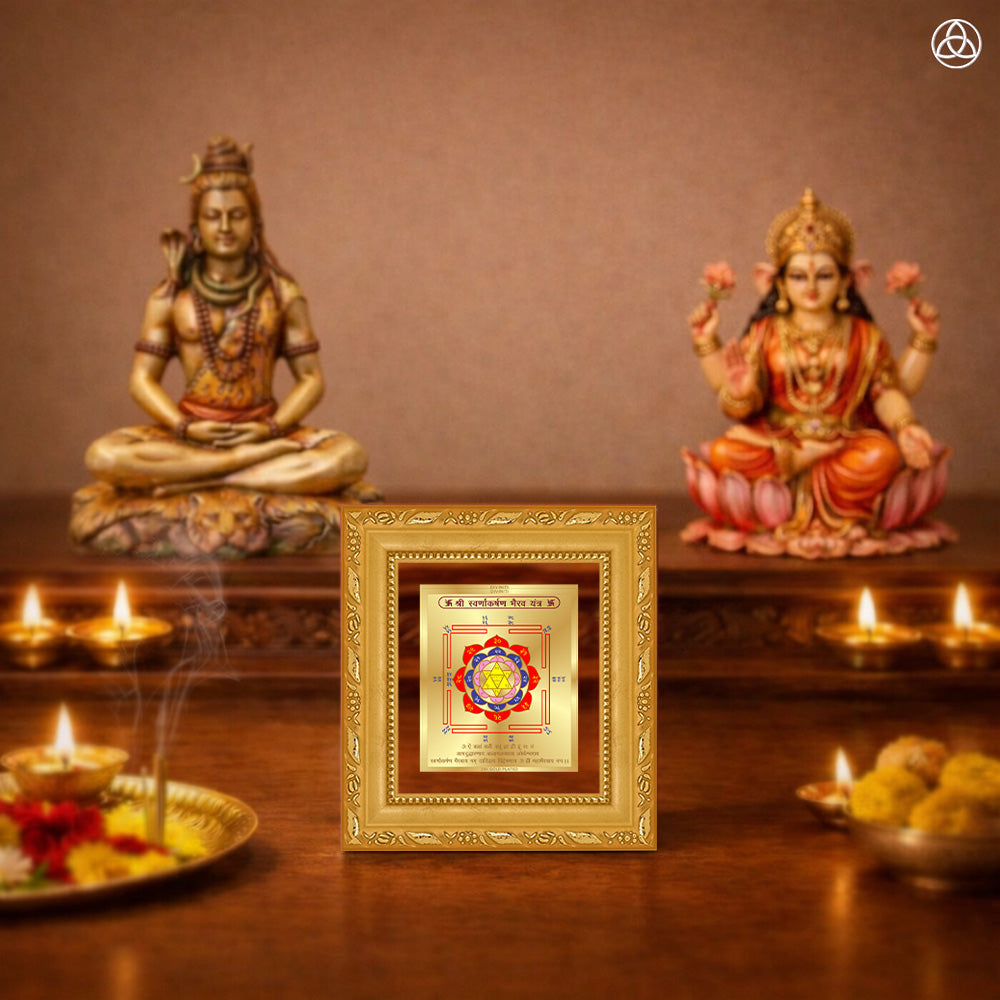 Swarn Akarshan Yantra displayed on a decorated altar with candles and idols of Hindu deities for spiritual harmony.