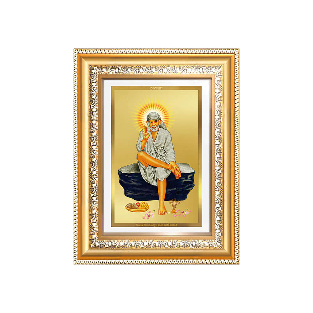 Sai Baba photo frame in 24K gold-plated foil, showcasing the saint sitting gracefully on a rock.