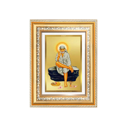 Sai Baba photo frame in 24K gold-plated foil, showcasing the saint sitting gracefully on a rock.