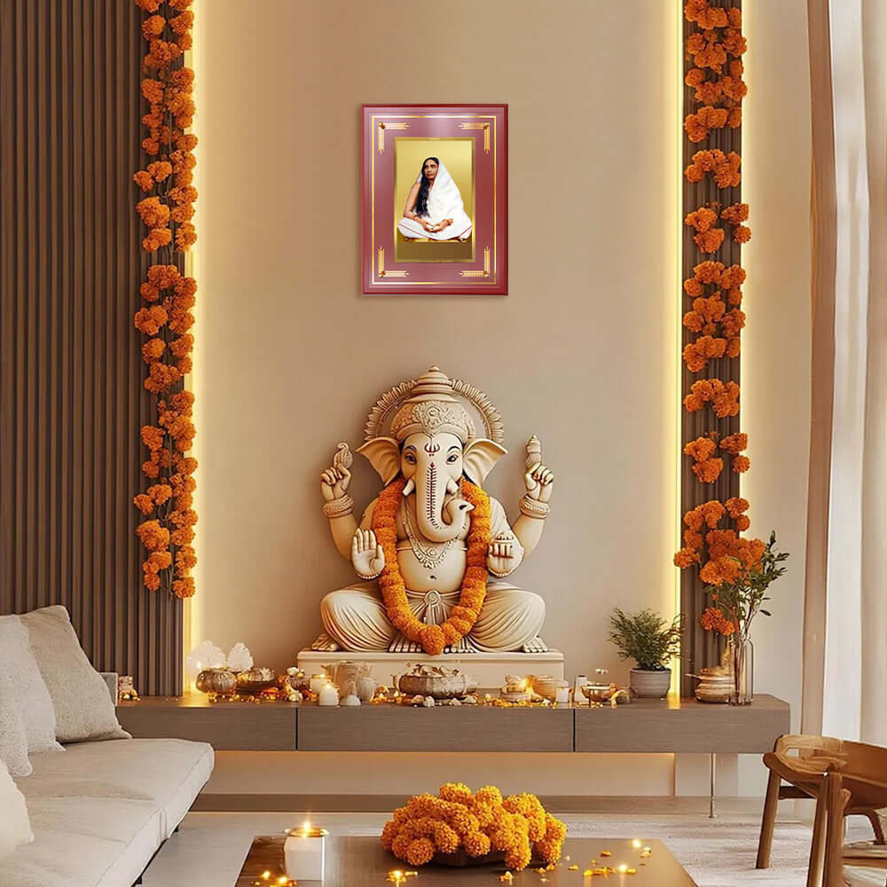 Sarada Devi Wall and Tabletop Photo Frame in 24K Gold Plated Foil displayed above a Ganesha statue in a serene setting.