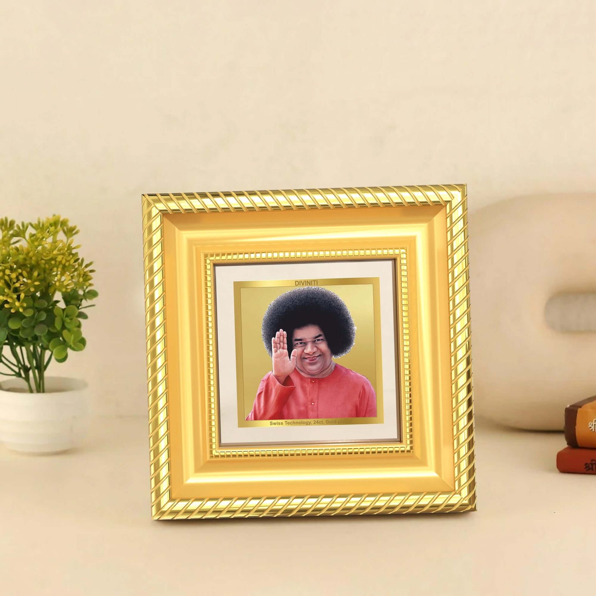 Sathya Sai Baba Tabletop Frame in 24K Gold Plated Foil displayed on wooden table