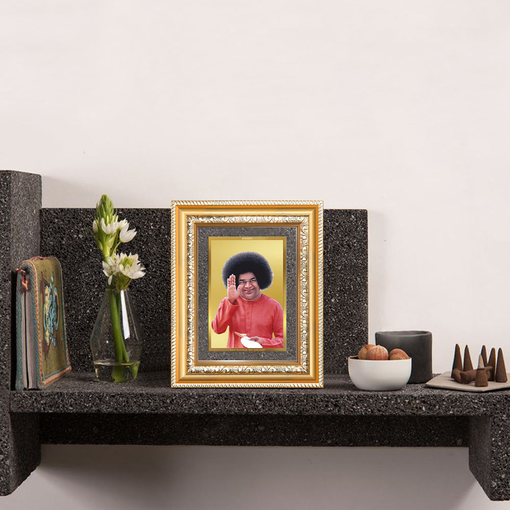 Sathya Sai Baba Tabletop Photo Frame in 24K Gold Plated Foil displayed on wall