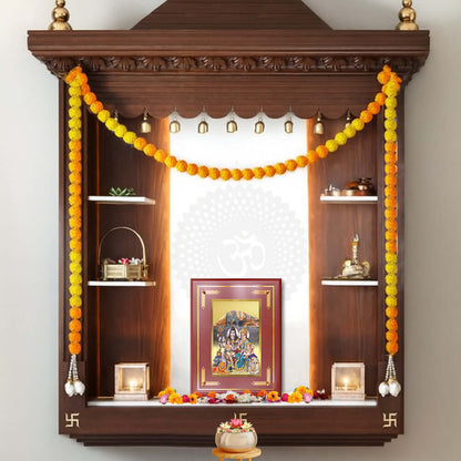 Shiva Parivar photo frame displayed on wooden wall shelf