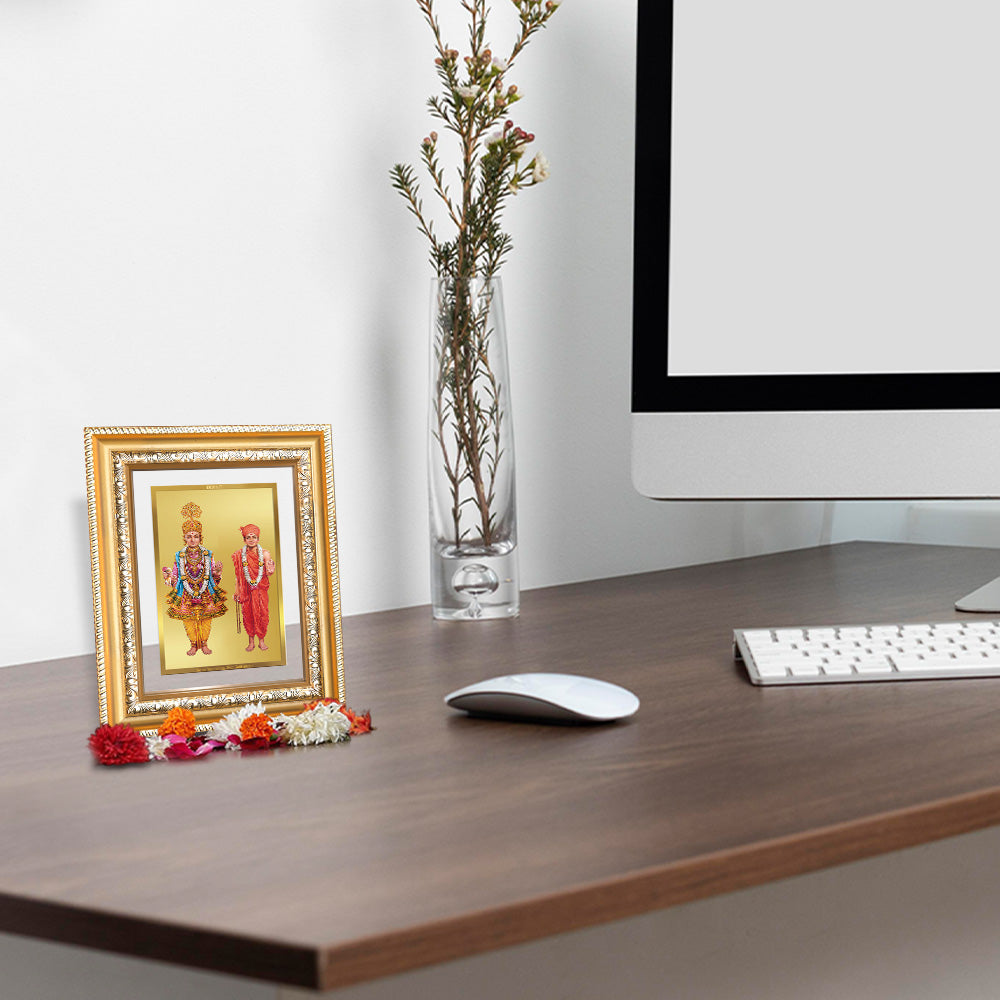 Lord Swaminarayan Photo Frame  in 24K Gold Plated Foil displayed on wooden table