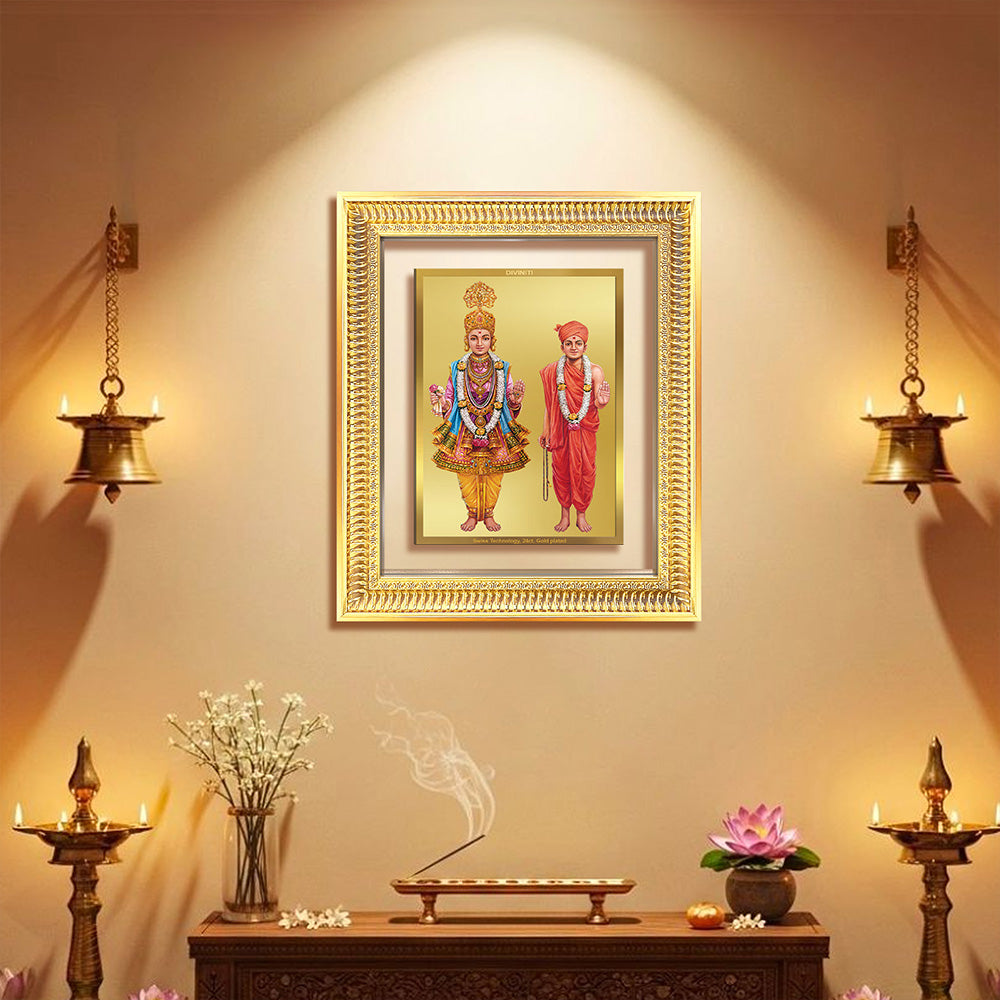Lord Swaminarayan Wall & Tabletop Frame in 24K gold-plated foil decor on a dimly lit wall.