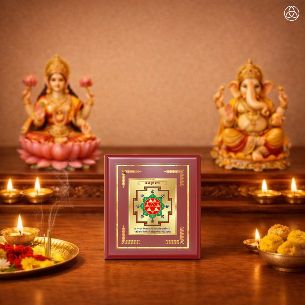 Vahan Durghtna Yantra displayed on a decorated altar with candles and idols of Hindu deities for spiritual harmony.