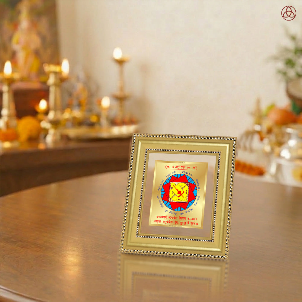 Vastudosh Nivaran Yantra displayed in a decorative frame on a wooden table, symbolizing planetary energies