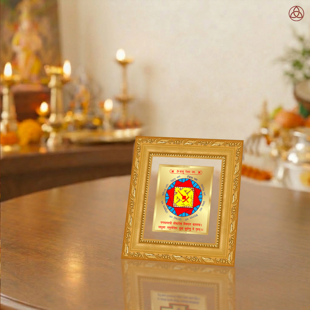 Vastudosh Nivaran Yantra displayed in a decorative frame on a wooden table, symbolizing planetary energies