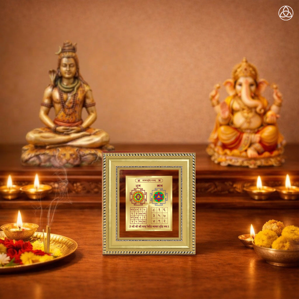 Vyapar Vriddhi Yantra in a decorative frame on a traditional altar with deities and offerings.