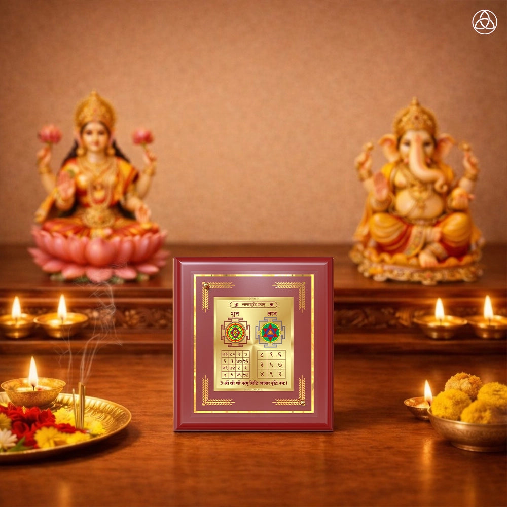 Vyapar Vriddhi Yantra in a decorative frame on a traditional altar with deities and offerings.